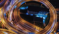A nighttime view of a highway from above